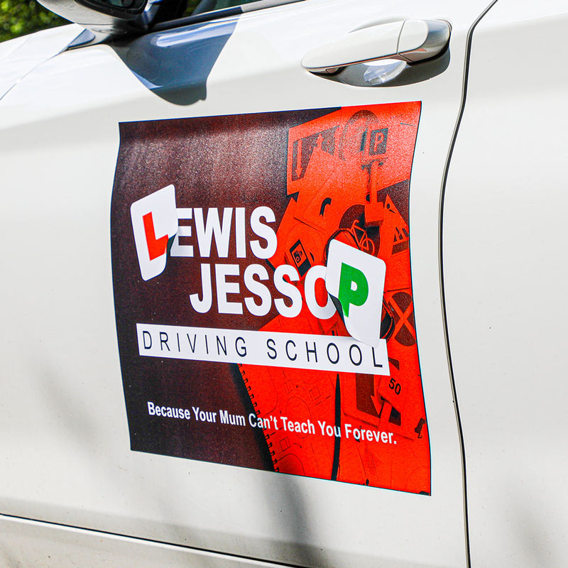 Printed magnetic sign fitted to a car door