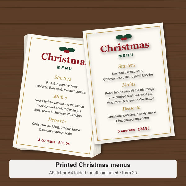 Stack of printed A5 Christmas menus on a table